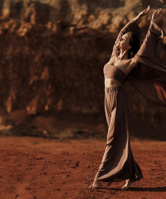 Tourist Stretching at Wadi Rum