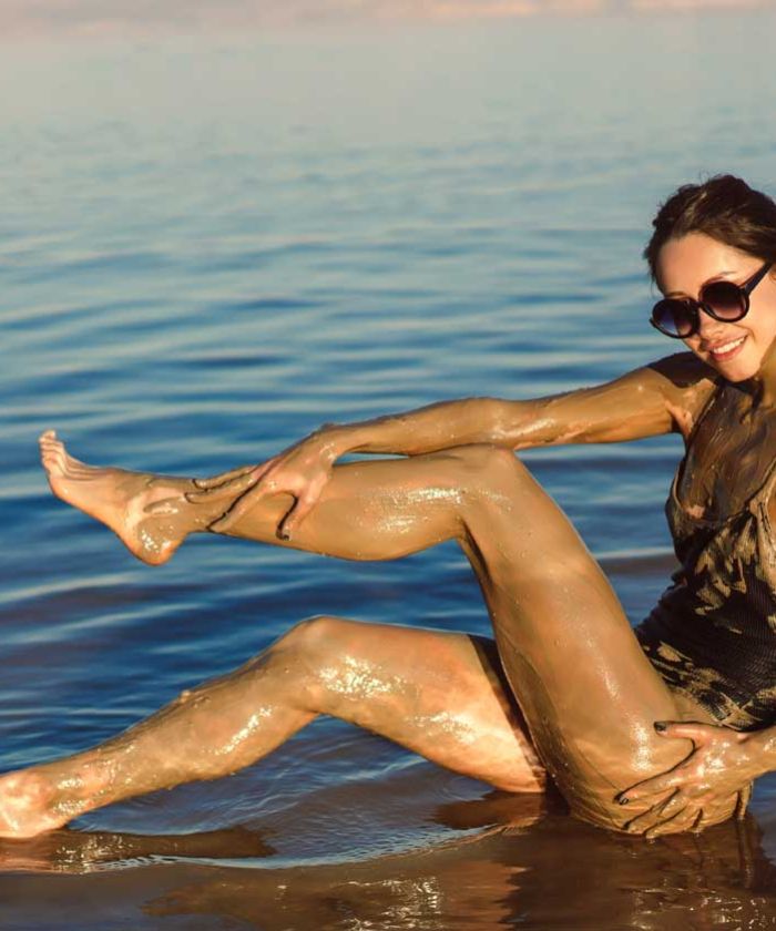  Tourist Experiencing Dead Sea Mud Party